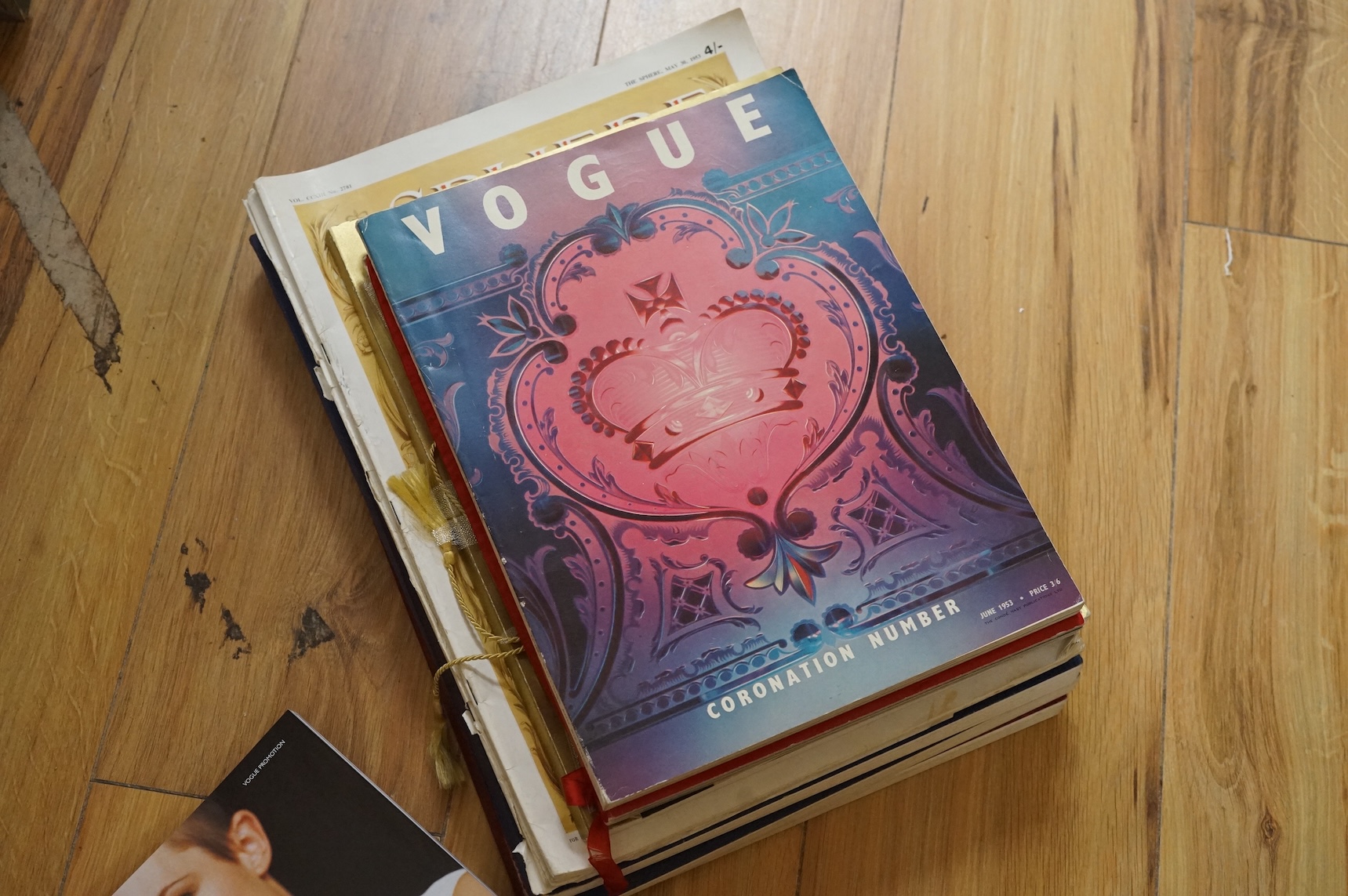 A collection of commemorative books and magazines to include Vogue